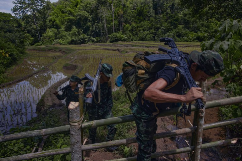 KNDO and Arakan army soldiers patrol the Mutraw district countryside in Karen State. With decades of experience in fighting against the oppressive Burma army regime, resistance groups from all over Myanmar send their soldiers to train within the ranks of Karen's military wings. [Al Jazeera] - DO NOT USE