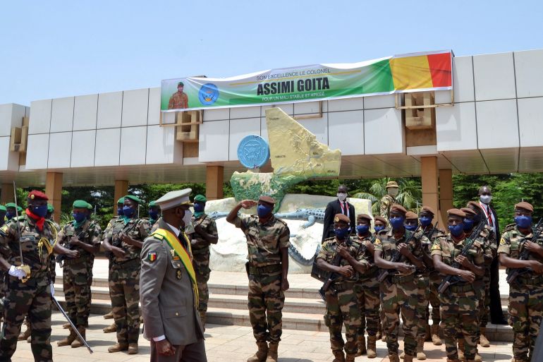 Colonel Assimi Goita, new interim president of Mali, walks during his inauguration ceremony in Bamako, Mali