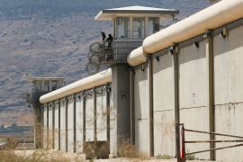 A guard at an observation tower along a wall of Gilboa Prison,in northern Israel