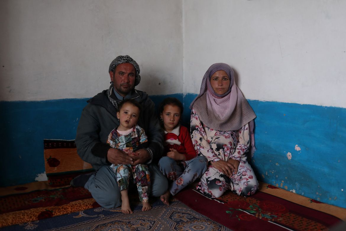 Sayed Yassin Mosawi, poses for a photograph with his family in Bamiyan, Afghanistan