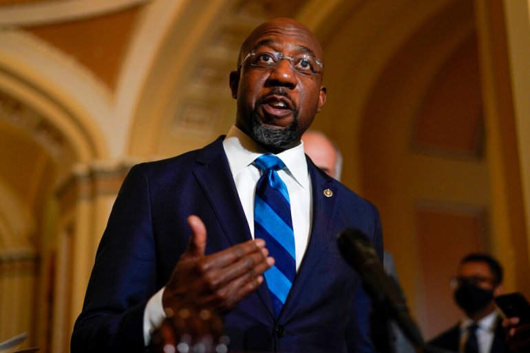 Georgia Democrat Senator Raphael Warnock speaks during a news conference after the weekly Democratic policy luncheon on Capitol Hill. 