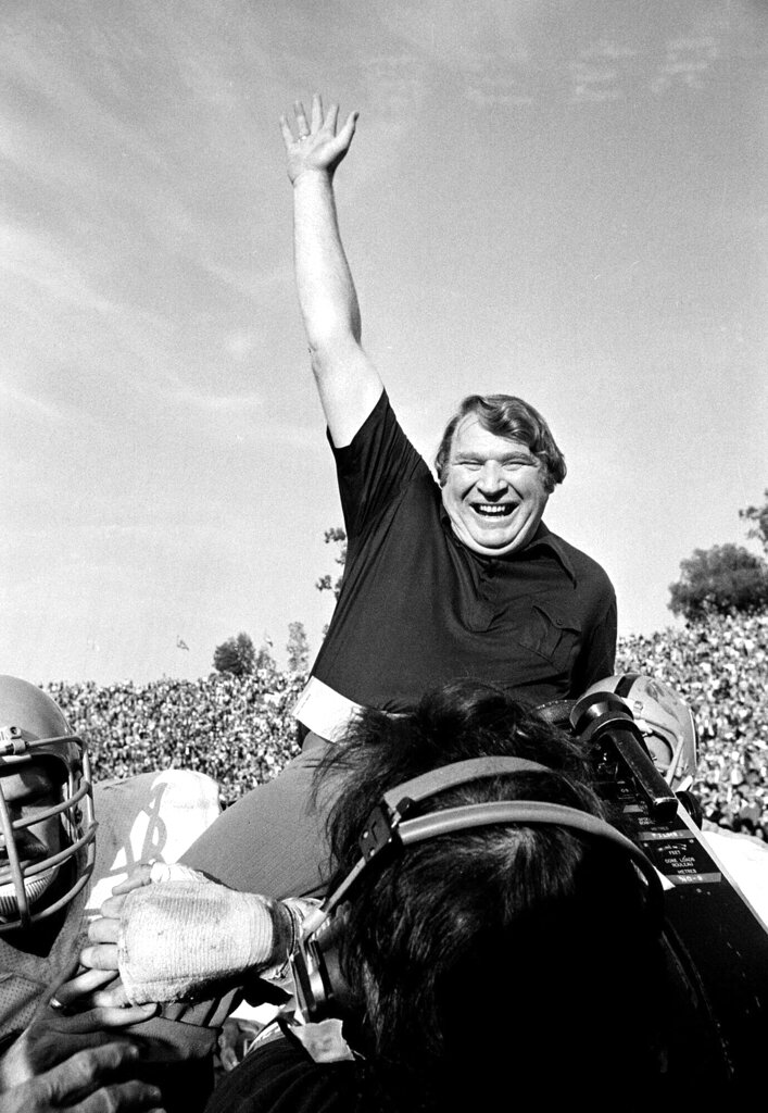 Coach John Madden of the Oakland Raiders is carried triumphantly from the field by his players after his team defeated the Minnesota Vikings in Super Bowl XI 