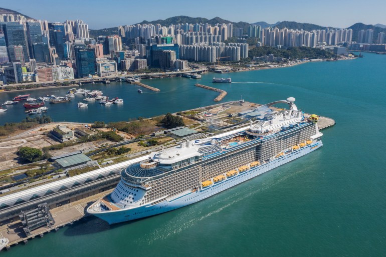 The aerial photo shows the cruise ship "Spectrum of the Seas" docked at a terminal in Hong Kong on January 5, 2022, after it was ordered to return to the city for coronavirus testing after nine people were found to be close contacts with a recent Omicron variant outbreak.
