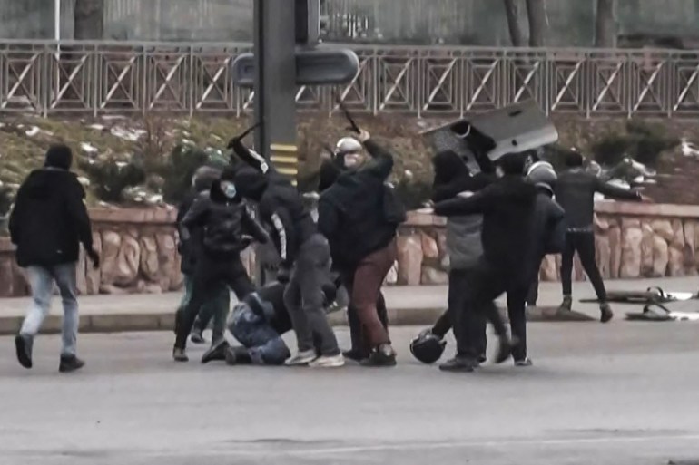 Protesters clash with Kazakstan's security forces during a demonstration in Almaty