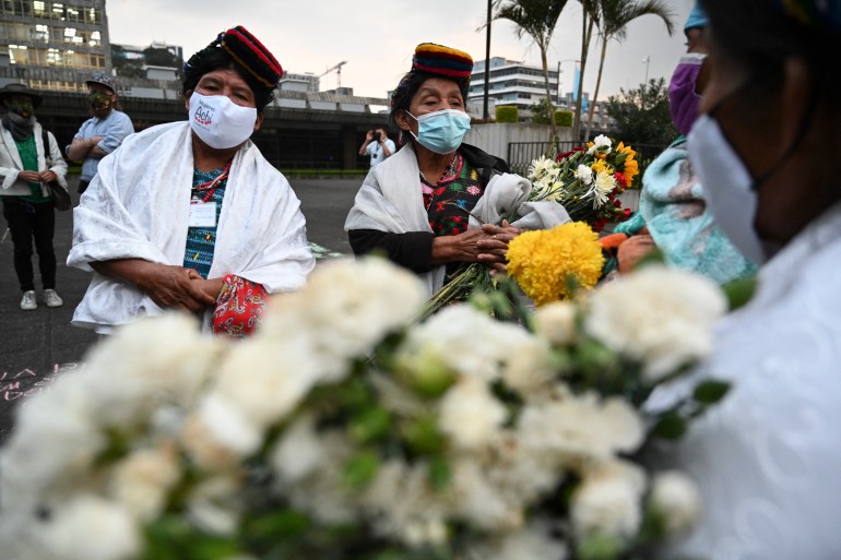 Guatemalan Achi women, victims of sexual violence during the internal armed conflict (1960-1996), react at the end of the trial against five former Guatemalan Civil Patrol (PAC) members, outside the Justice Palace in Guatemala on January 24, 2022.