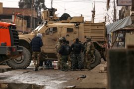 Syrian Democratic Forces (SDF) gather in the neighbourhood of Ghwayran, in the northeastern Syrian city of Hasakeh, to search for affiliates of the the Islamic State (ISIL) group