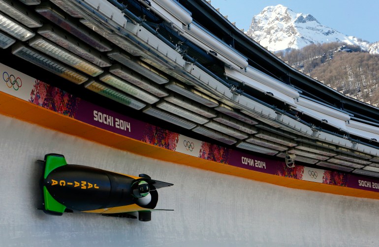 Jamaica's pilot Winston Watts (front) speeds down the track during a two-man bobsleigh training session at the Sanki Sliding Center in Rosa Khutor, a venue for the 2014 Sochi Winter Olympics near Sochi