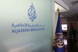 The Al Jazeera Media Network logo is seen inside its headquarters in Doha.