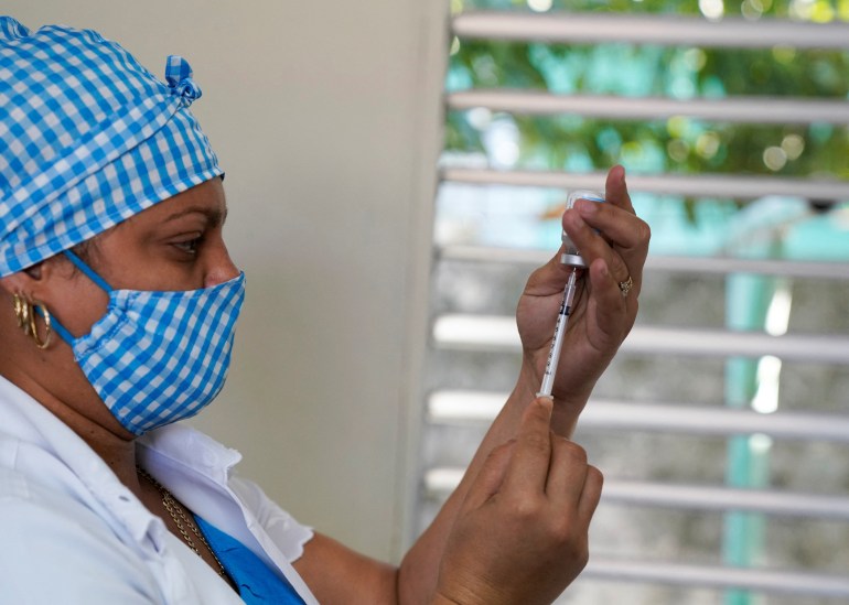 A nurse prepares a booster dose of the Abdala vaccine against the coronavirus disease (COVID-19), in Havana, Cuba