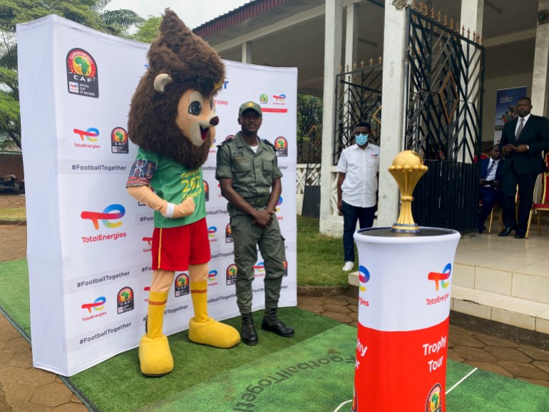 People gather around the AFCON mascot during the presentation tour in Cameroon