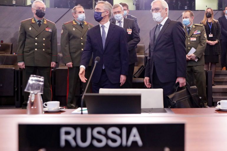 Russian Deputy Foreign Minister Alexander Grushko and NATO Secretary-General Jens Stoltenberg are seen at the military alliance's headquarters in Brussels