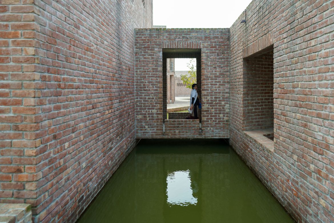 Rain Harvesting Canal crisis crossing insides the friendship hospital. The canals are designed for microclimatic cooling and work as a divider, in terms of zoning of the hospital