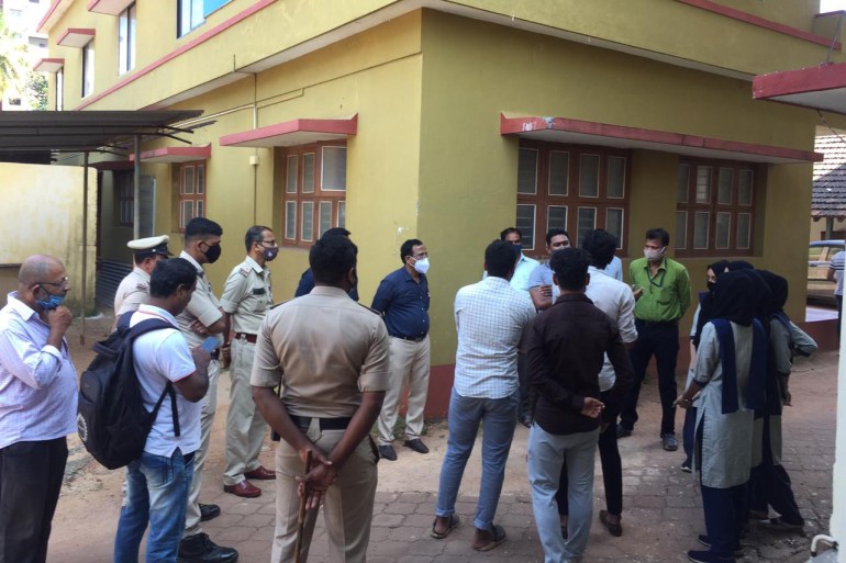 Students interacting with police and officials at the college