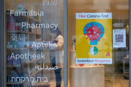 A sign advertises Covid-19 tests in the window of a pharmacy in Berlin, Germany