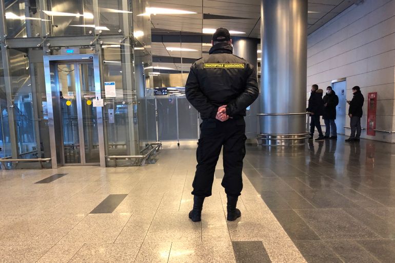 A security stands guard in the arrivals hall in Vnukovo airport