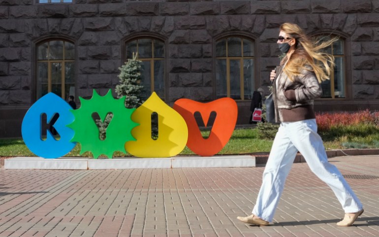 A young woman walks along Kyiv's main Khreschatyk Street