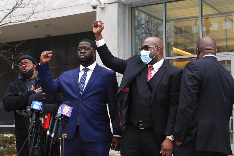 Philonise Floyd, George Floyd's brother, and Brandon Williams, George Floyd's nephew, reacts during a news conference after former Minneapolis Police Officer Derek Chauvin has pleaded guilty to a federal charge of violating George Floyd's civil rights.