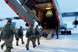 Russian peacekeepers board a Russian military plane at an airfield outside Moscow, Russia, to fly to Kazakhstan