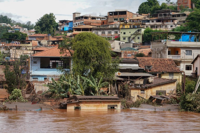 Floodwaters cover a residential street in Raposos, Minas Gerais state, Brazil