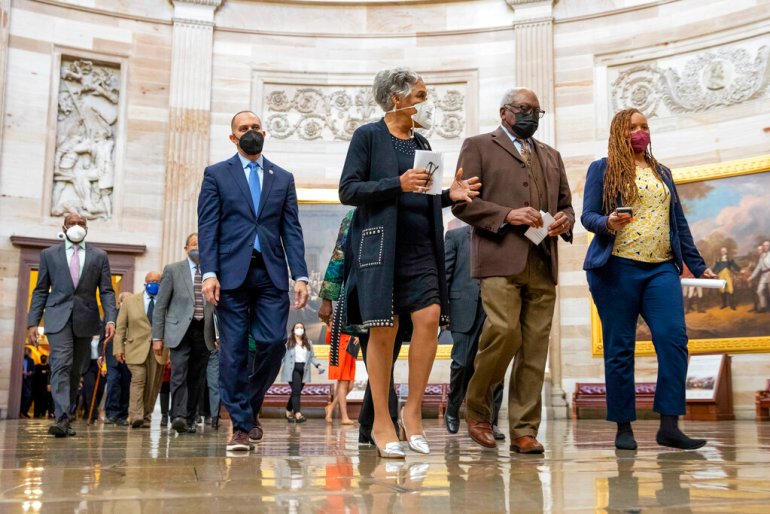 Rep. Hakeem Jeffries, D-N.Y., Rep. Joyce Beatty, D-Ohio, and House Majority Whip Jim Clyburn, D-S.C., and other members of the Congressional Black Caucus, walk to the Senate chamber to speak to reporters about their support of voting rights legislation.