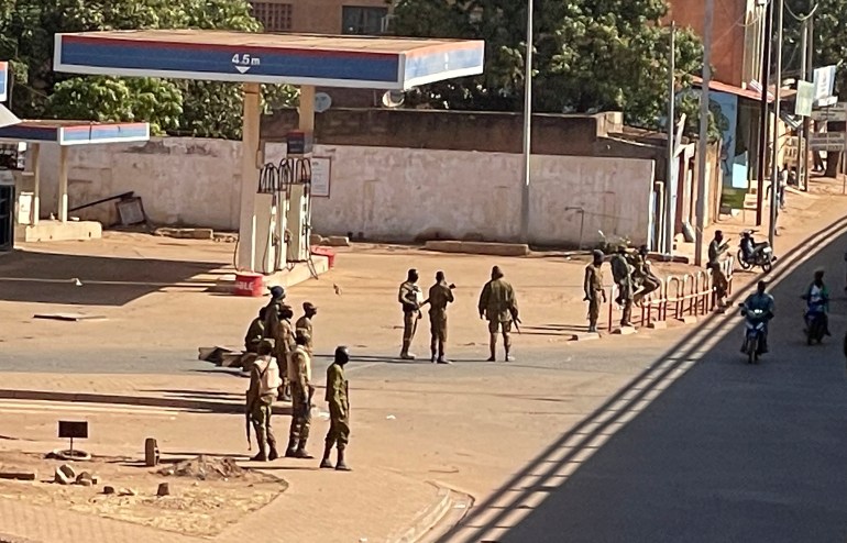 Soldiers stand outside a military base in Burkina Faso's capital Ouagadougou 