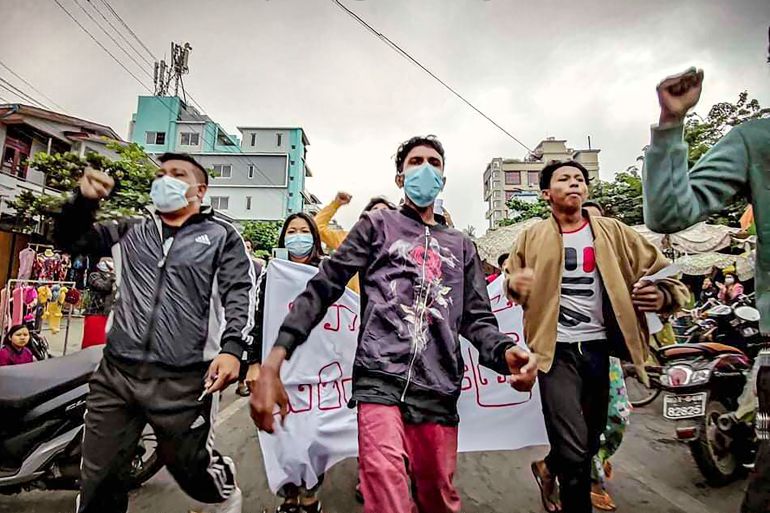 Protesters march through the streets during an anti-government demonstration in Mandalay, Myanmar,