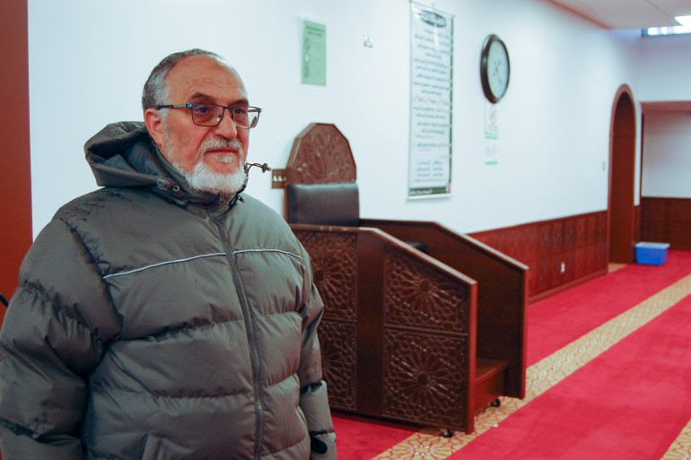 Mohamed Labidi stands in the main prayer room at the Islamic Cultural Centre in Quebec City