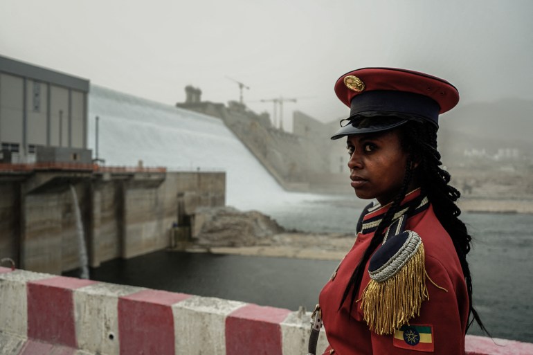 A member of the Republican March Band poses for photo before at the ceremony for the inaugural production of energy at the Grand Ethiopian Renaissance Dam