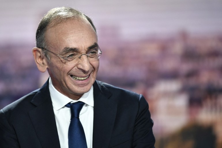 French far-right party Reconquete! presidential candidate Eric Zemmour smiles
