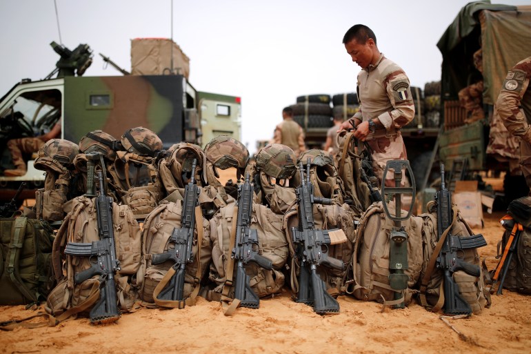 A French soldier of the 2nd Foreign Engineer Regiment prepares his equipment at a temporary forward operating base (TFOB) during Operation Barkhane in Ndaki, Mali