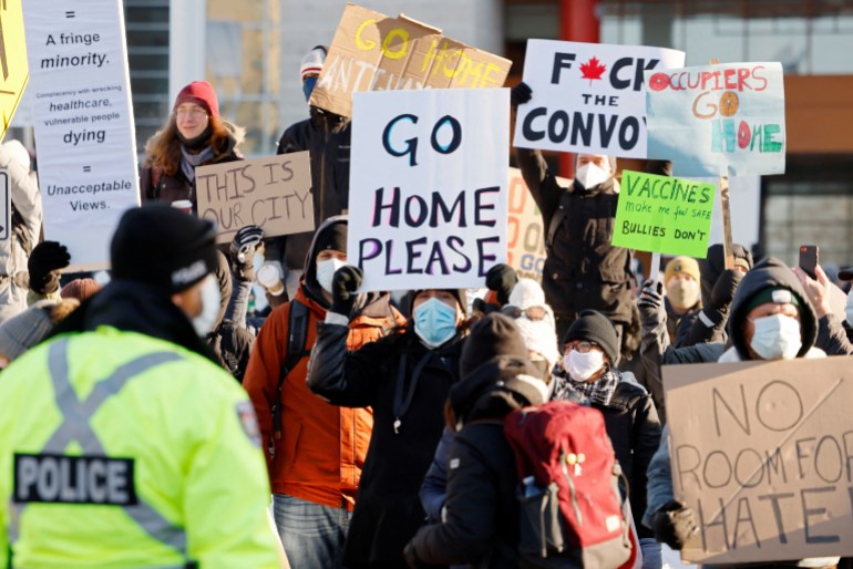 Demonstrators stage a counter-protest at city hall as truckers and supporters continue to protest against the coronavirus disease (COVID-19) vaccine mandates, in Ottawa, Ontario, Canada, February 5, 2022