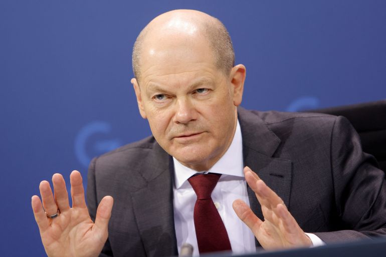 German Chancellor Olaf Scholz gestures during a news conference with Berlin Mayor Franziska Giffey and state premier of North Rhine-Westphalia Hendrik Wuest, following a meeting with the 16 state leaders on latest coronavirus disease (COVID-19) measures in Berlin, Germany February 16, 2022. REUTERS/Michele Tantussi/Pool