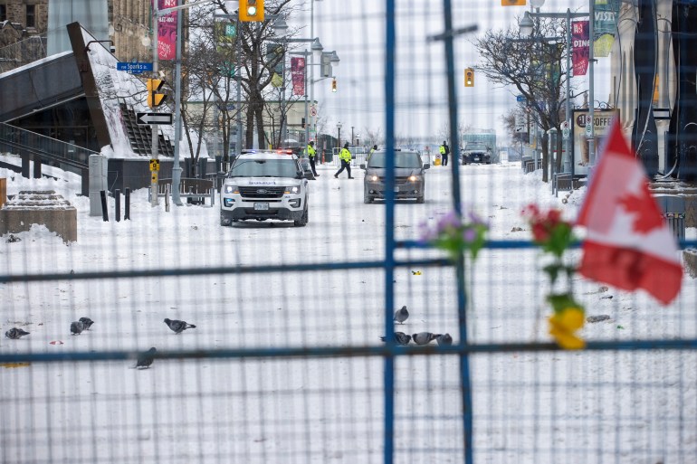 A police car is seen behind a barricade in Ottawa, Canada