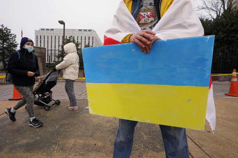 Person holding Ukrainian flag