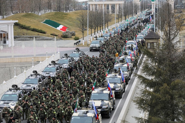 Chechen service members march