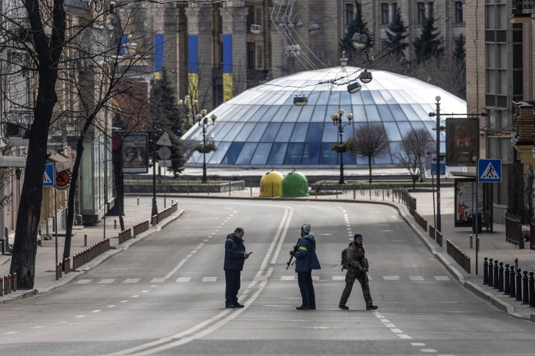Ukrainian forces are seen on a road in the centre of Kyiv
