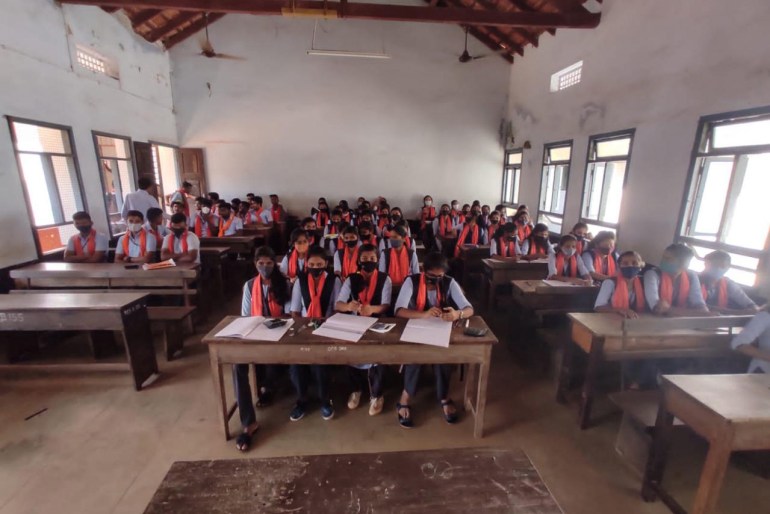Students donning saffron scarves at a private college in Basrur District