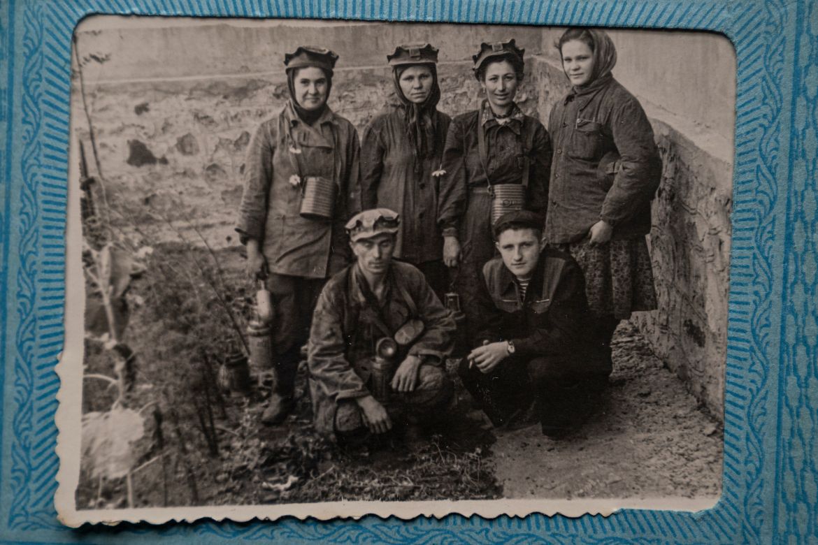 Ivanovna's family album shows her in a uniform (on the right), along with her colleagues as they prepare for a shift in a local mine, during the Communist era