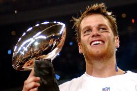New England Patriots quarterback Tom Brady holds the Vince Lombardi Trophy after the Patriots beat the Carolina Panthers 32-29 in Super Bowl 38 in Houston in 2004.