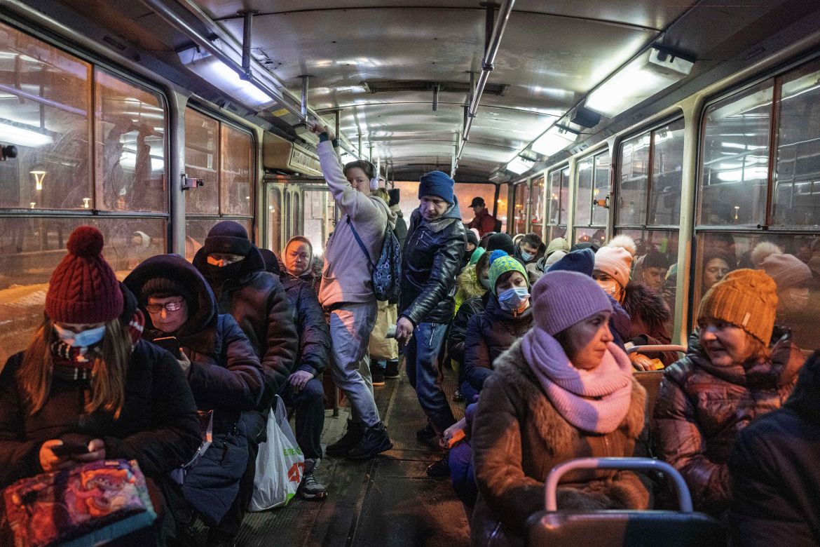 Passengers ride a bus in Kharkiv