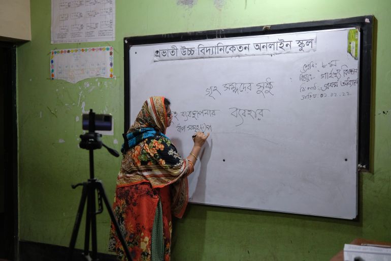 Teacher Lutfun Nahar Milu takes online classes for her students at one of the schools that have been shut down amid a surge in coronavirus infections at New Eskaton area in Dhaka, Bangladesh, Tuesday, Feb. 1, 2022. Bangladesh has reported more than 1.8 million COVID-19 cases and over 28,000 deaths since the pandemic started.