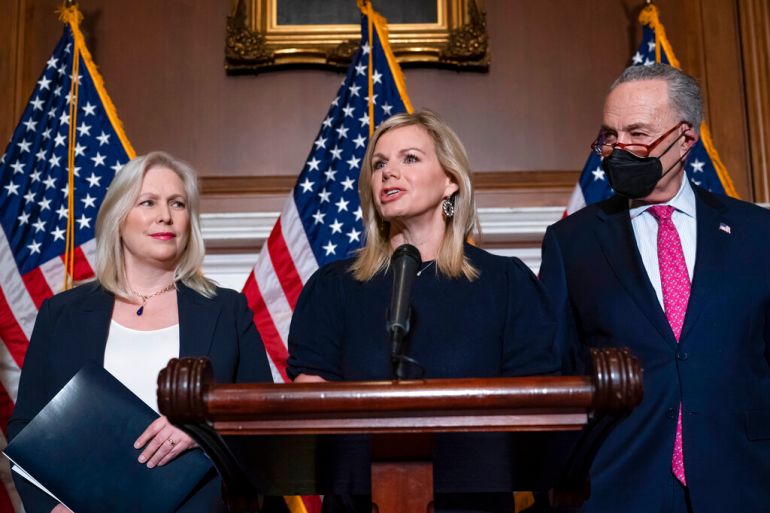 Former Fox News anchor Gretchen Carlson, center, joins Sen. Kirsten Gillibrand, D-N.Y., left, and Senate Majority Leader Chuck Schumer, D-N.Y., after Congress gave final approval to legislation guaranteeing that people who experience sexual harassment at work can seek recourse in the courts, during a news conference at the Capitol in Washington.