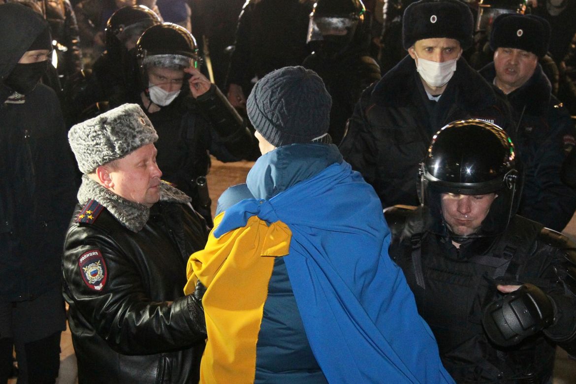 Police officers detain a protester in Nizhny Novgorod, Russia