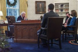 US President Joe Biden is seen in the Oval Office as he speaks by phone with Ukraine's President Volodymyr Zelenskiy