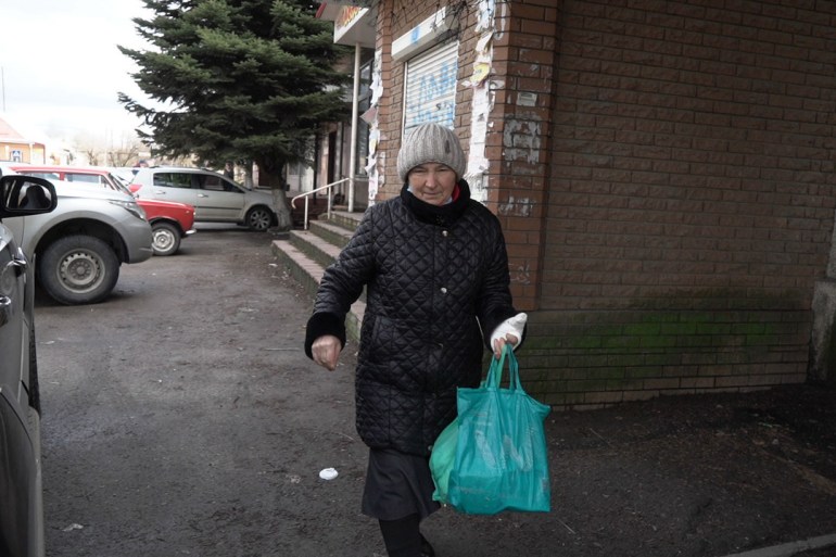 Valentina Gordeyeva with a bandaged hand injured by shelling in Marinka, eastern Ukraine