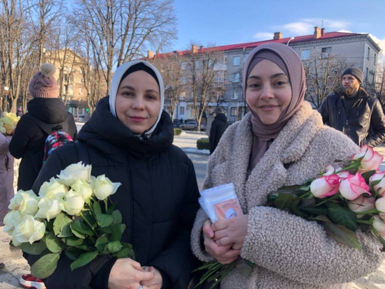Alime and Kamila celebrate Hijab Day in Kyiv [Nils Adler/Al Jazeera]