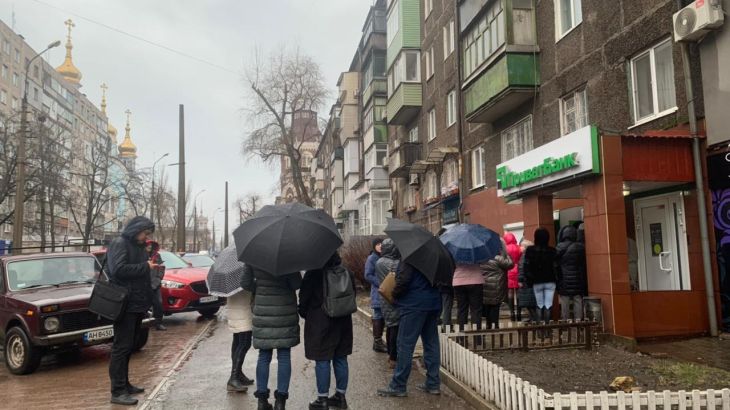 People queue at ATM in Mariupol
