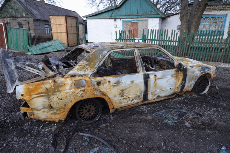 A damaged car in Tamarchuk village near Marinka not far from pro-Russian-fighters controlled city of Donetsk, Ukraine