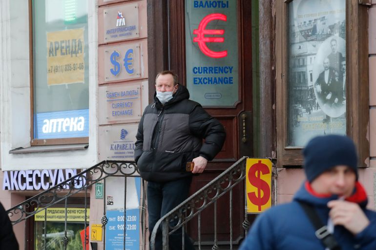 A Russian man exits from an exchange office in St Petersburg