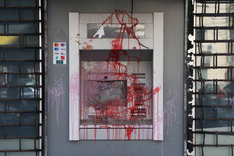 A damaged ATM cash machine is pictured in Beirut, Lebanon
